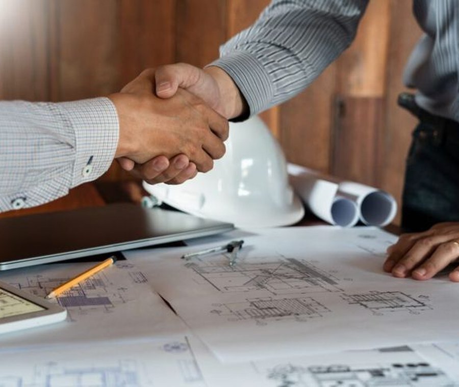 Handshake over project drawings