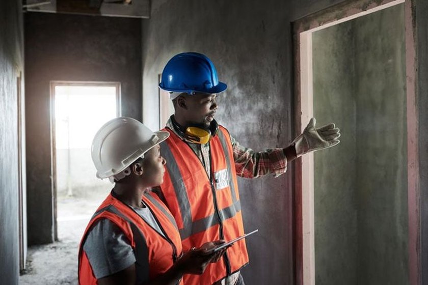 Engineers inspecting installed building services on site
